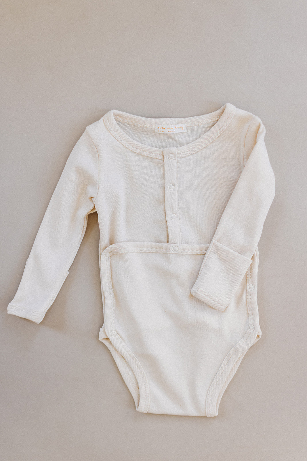 snap onesie, milk