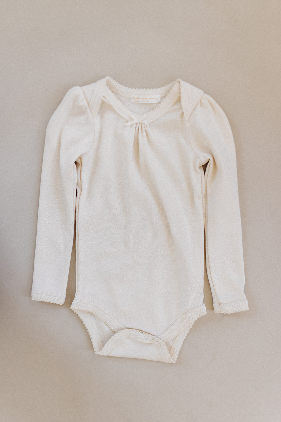 long sleeve pouf onesie, milk